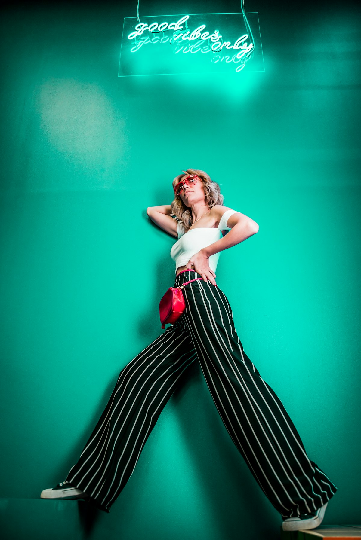 Model in studio light against plain background
