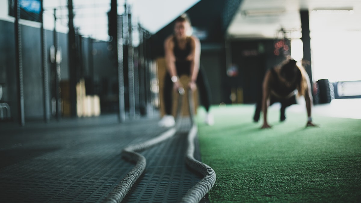 Group doing functional training with battle ropes