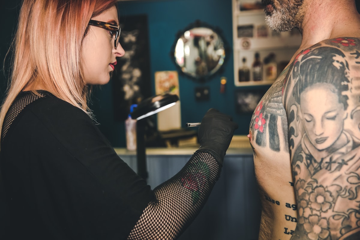 Fresh tattoo healing under film