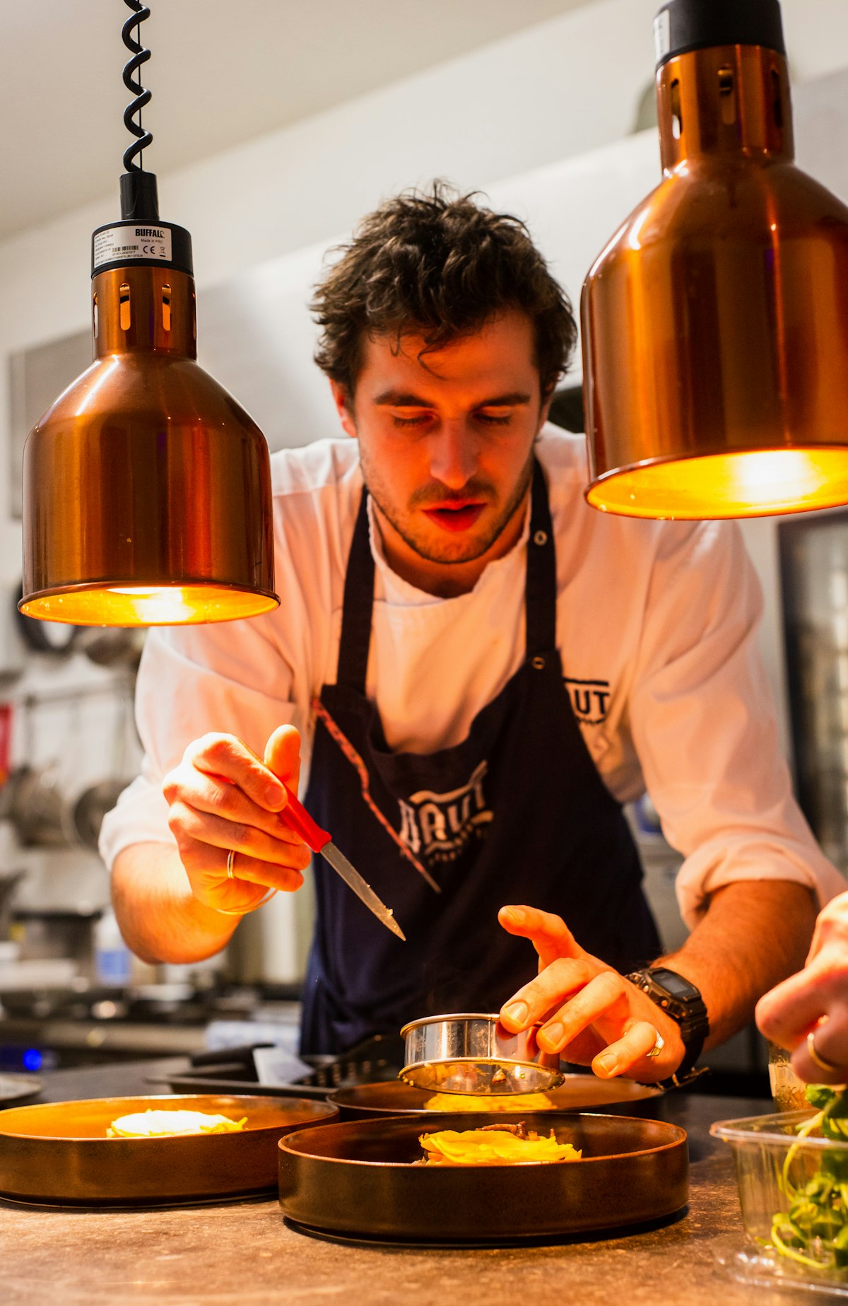 Our chef plating a festive first course