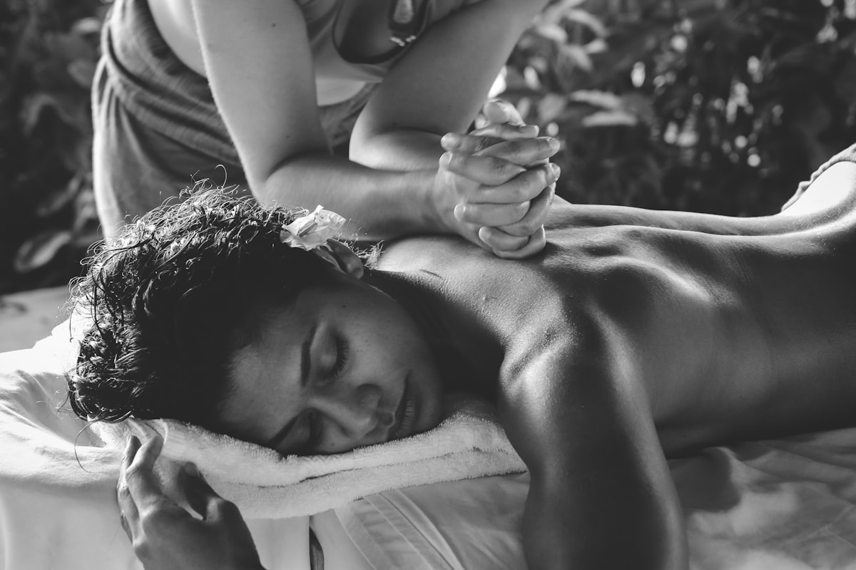 Warm herbal oil being poured for Abhyanga massage