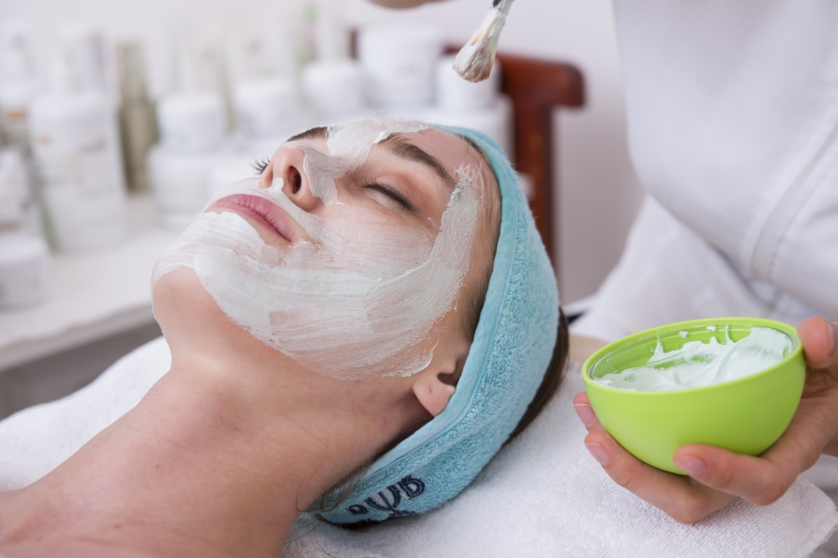 Woman touching her clear, healthy skin